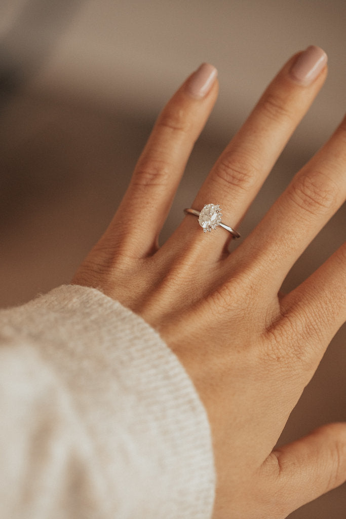 Solid Gold Oval Moissanite with .04 ct Side Flare Diamond Ring