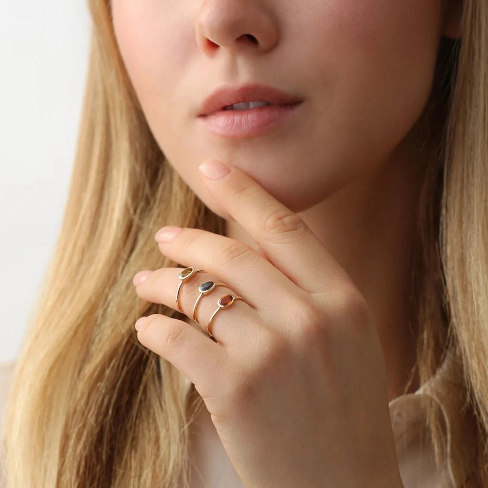 In Solid Gold Oval Peridot Ring