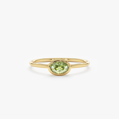 In Solid Gold Oval Peridot Ring