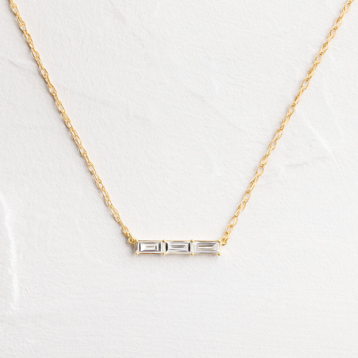 Solid Gold Fluency Three-Stone Baguette Necklace