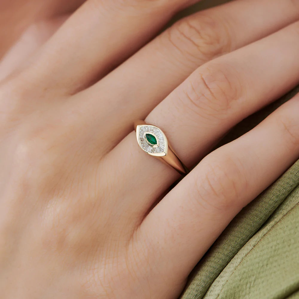 Solid Gold Marquise Shaped Emerald and Baguette Diamond Ring